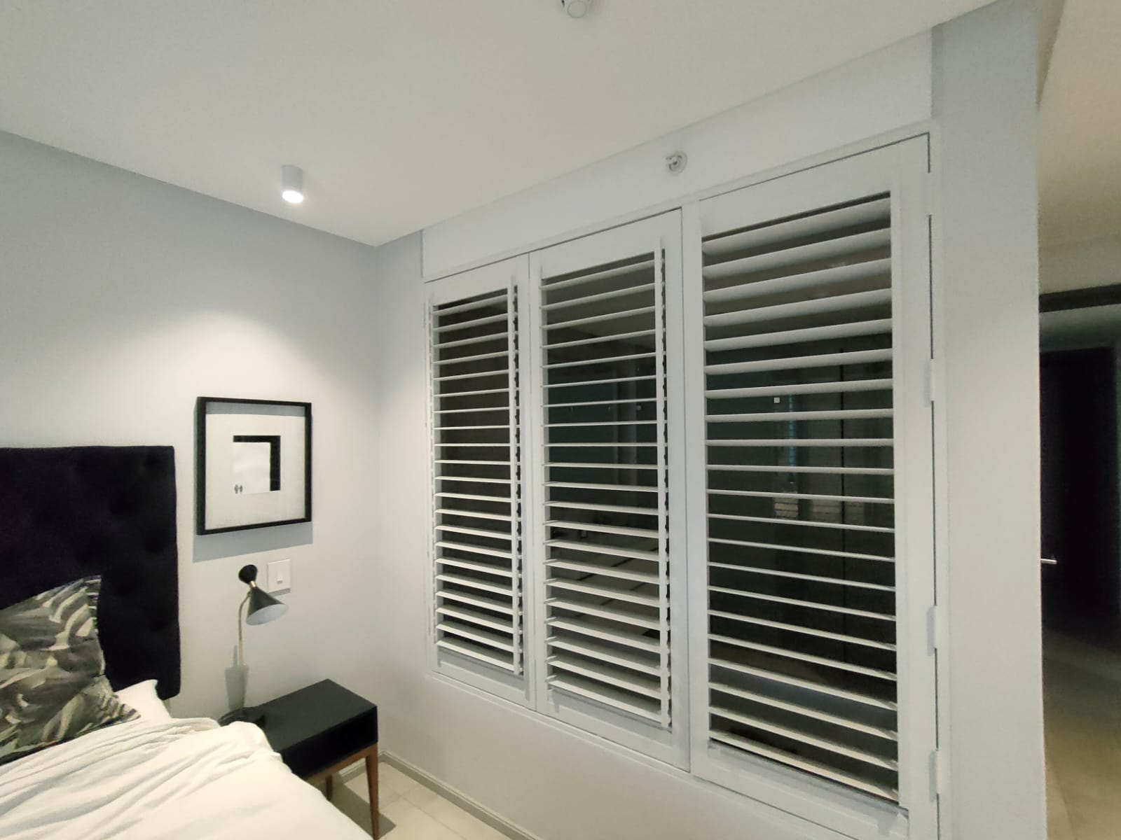 White plantation shutters bedroom