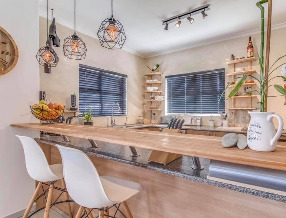 Dark venetian blinds designer kitchen